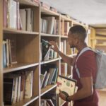 medium-shot-student-searching-books