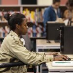 young-woman-studying-library